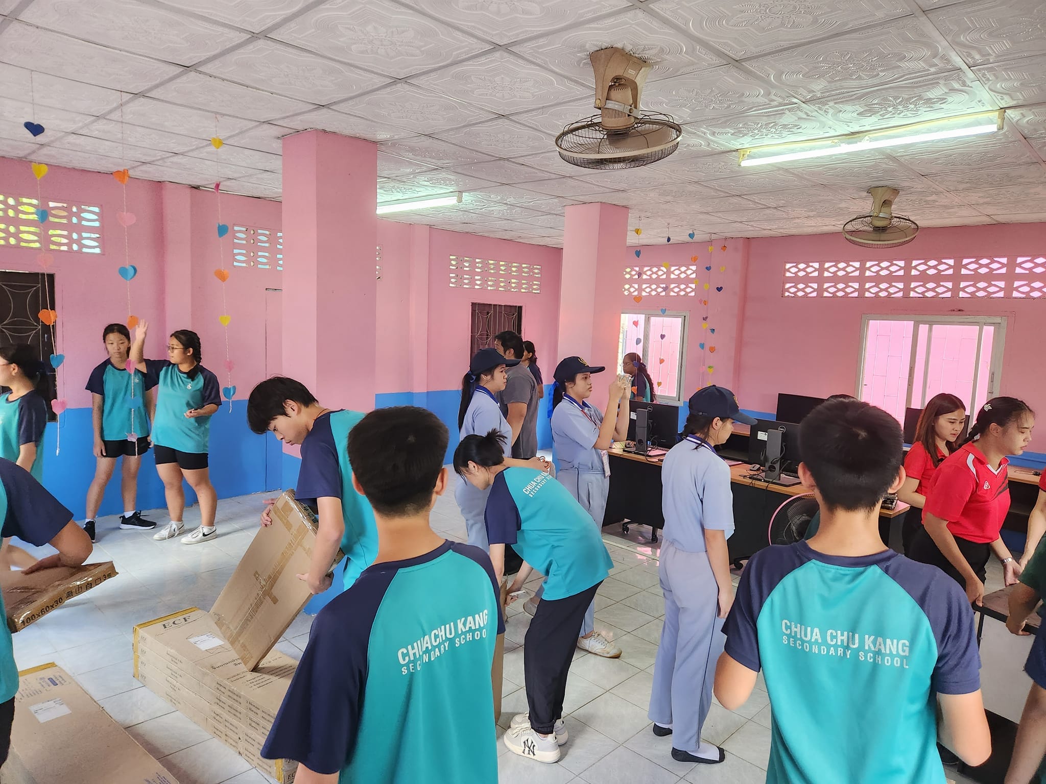 A group of students unpacking furniture.