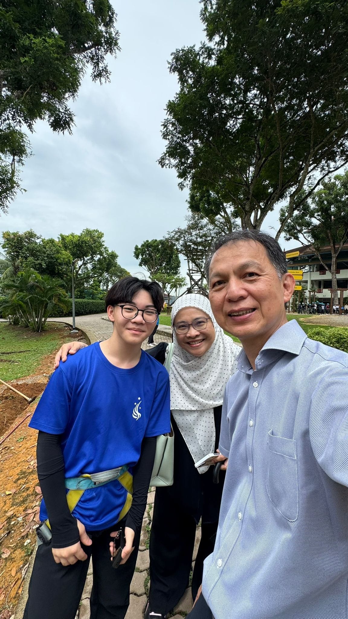 a boy poses next to the two VPs