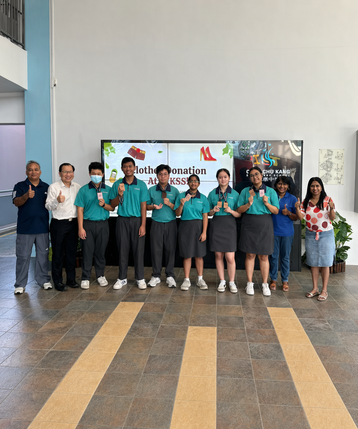 archery champions standing with school leaders