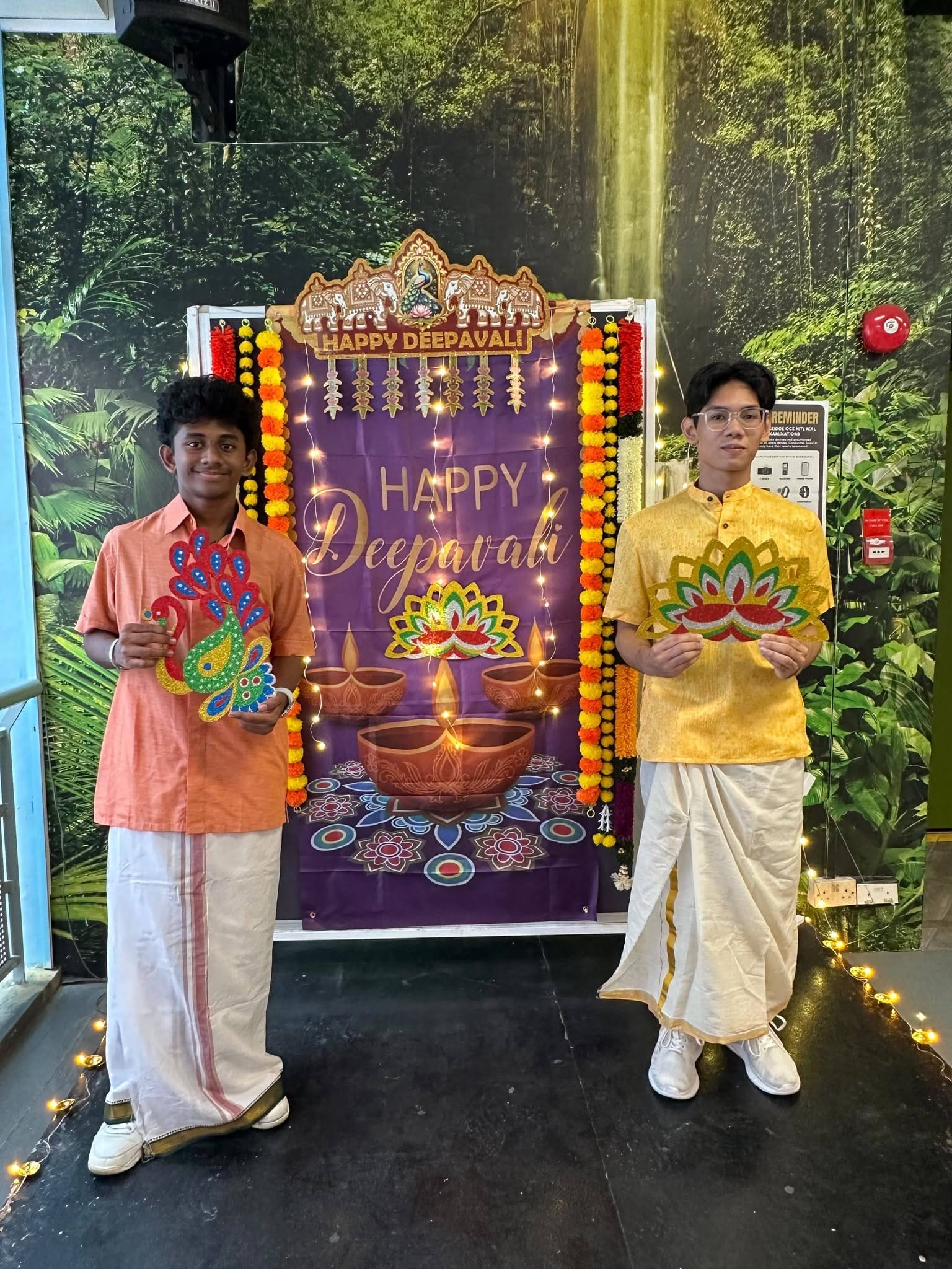 2 students in Indian traditional wear pose together