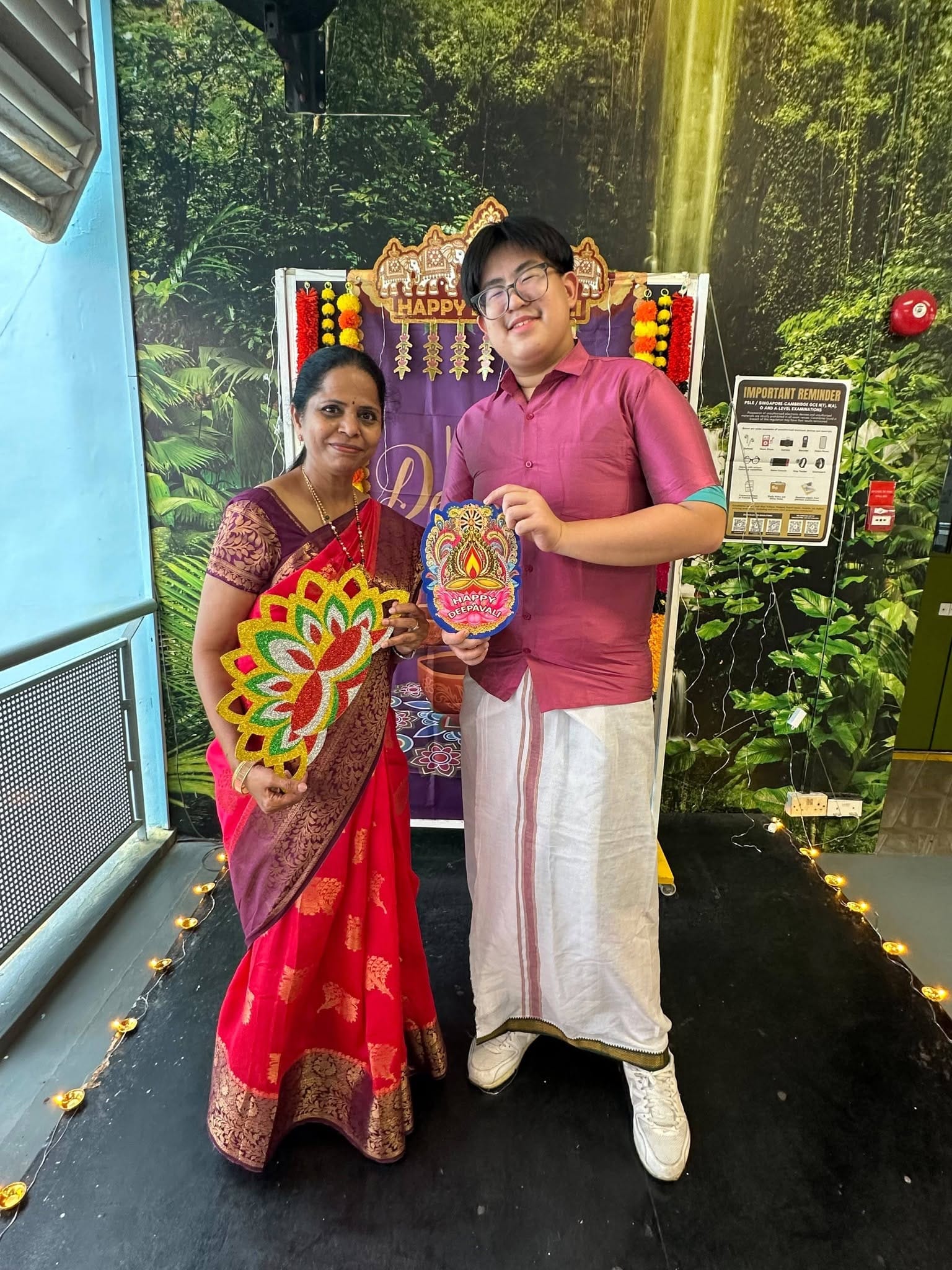 A student and teacher in traditional Indian wear