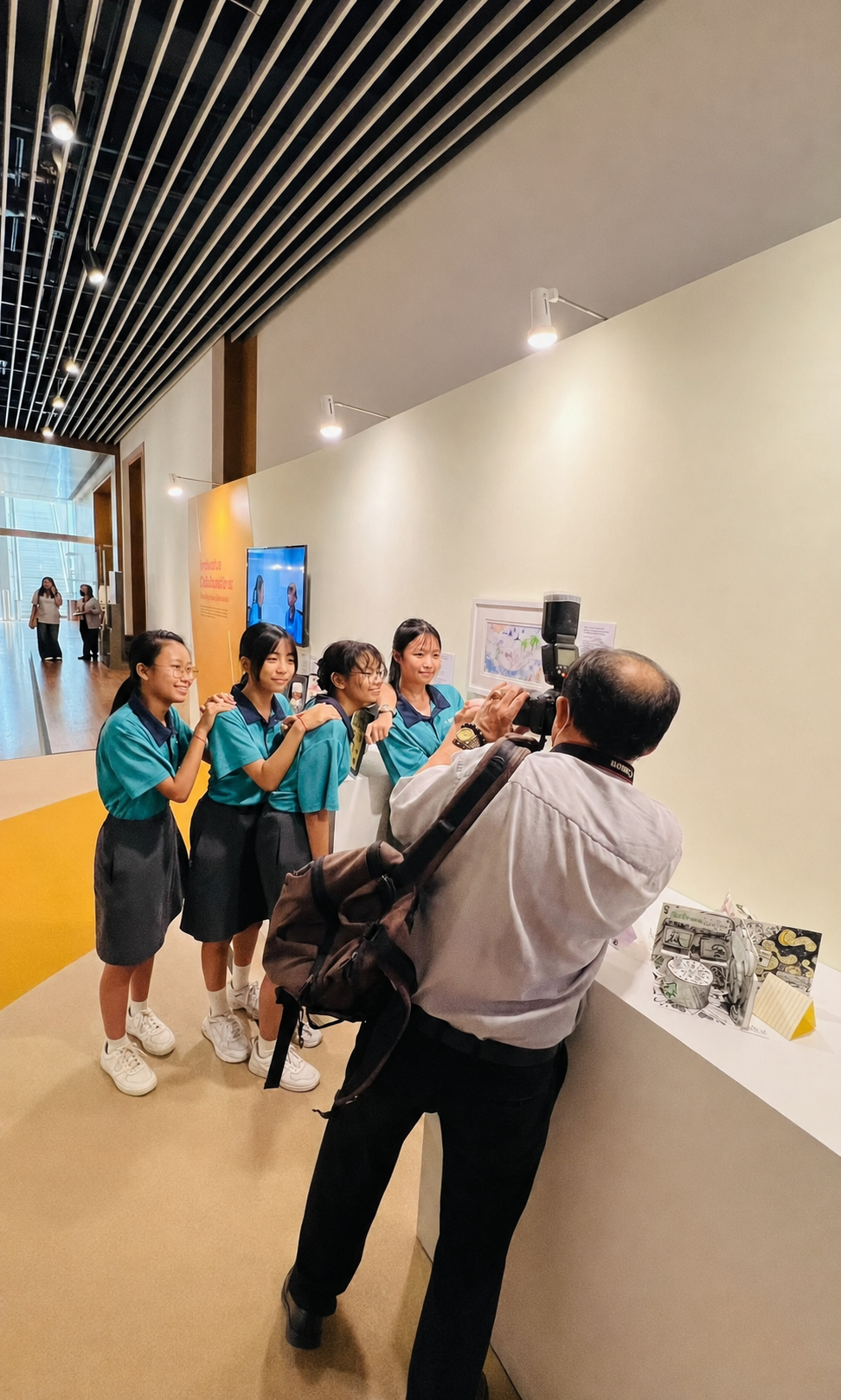 4 students pose for a photographer