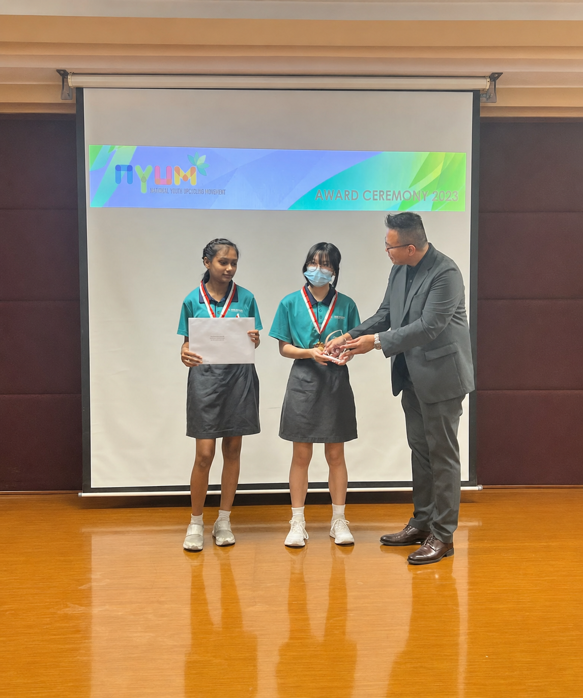 2 students receiving a prize