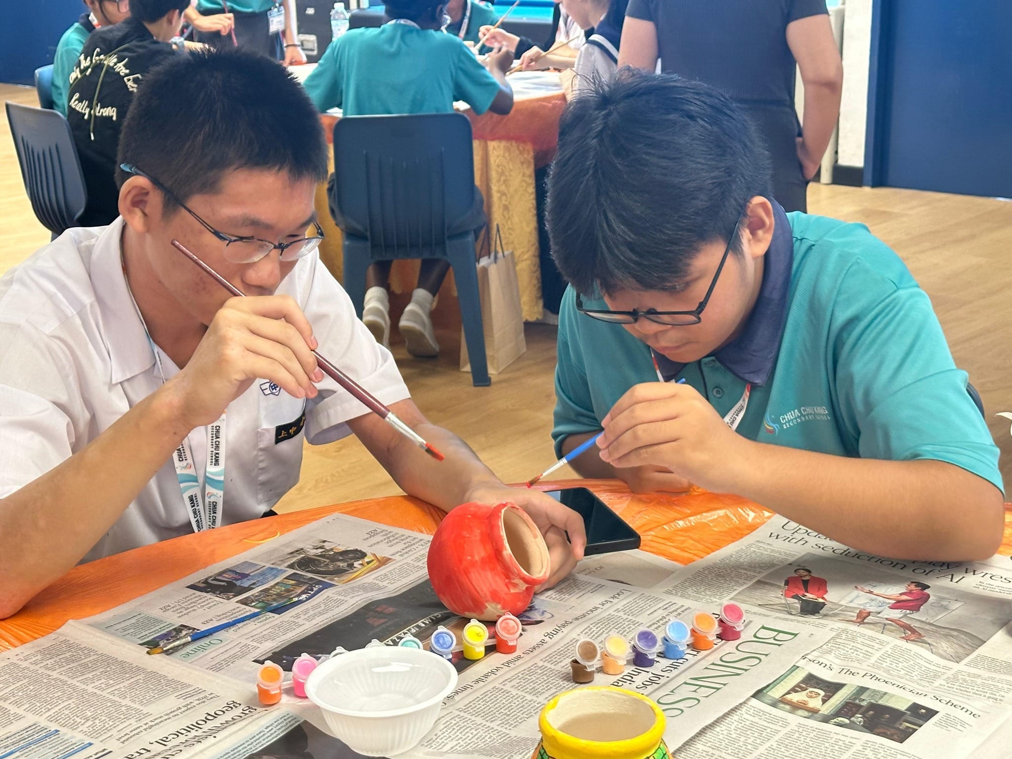 Students painting a pongal pot