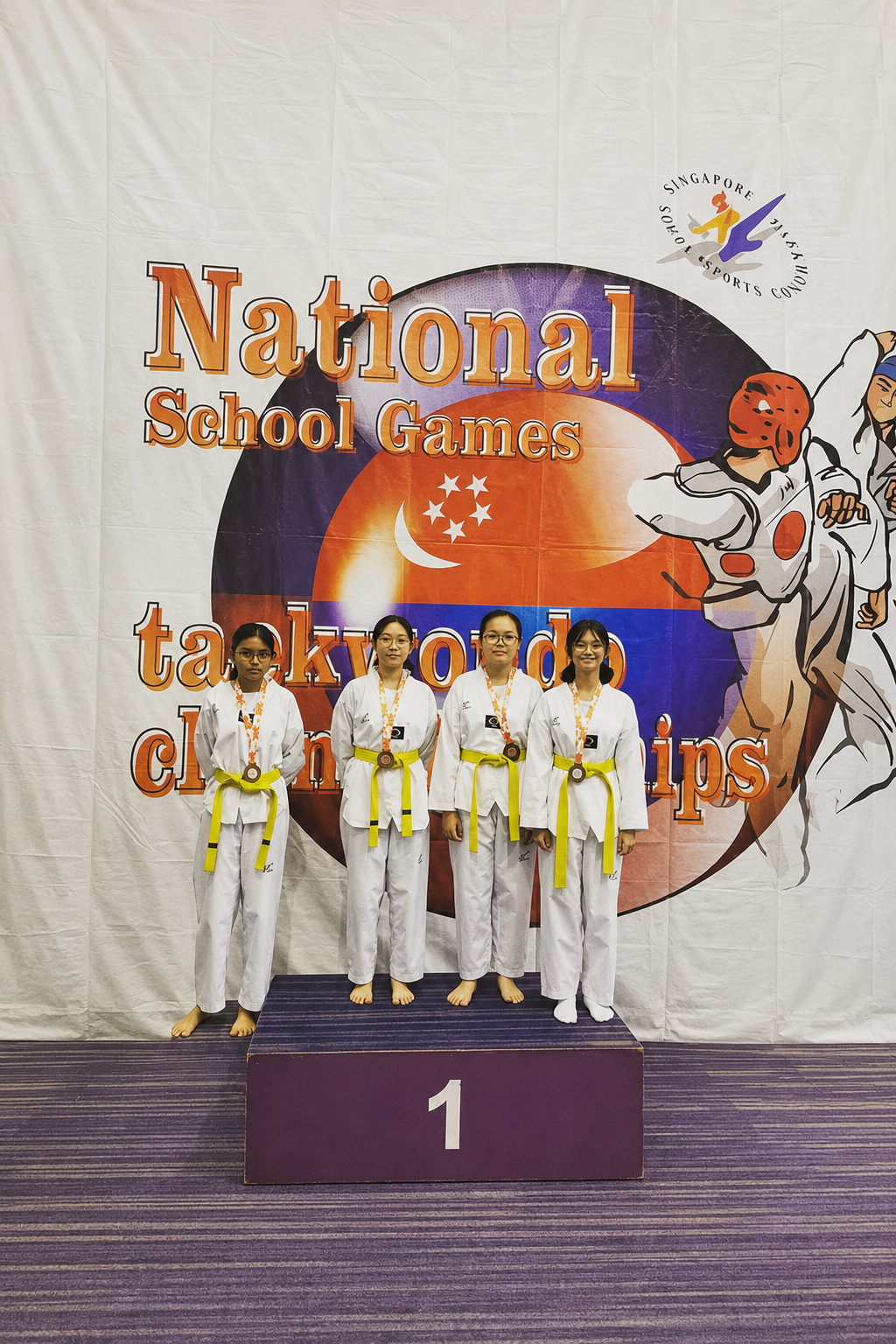 4 girls posing on a medal podium