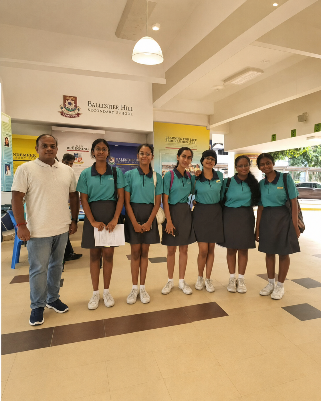 6 students and 1 teacher pose for a photo