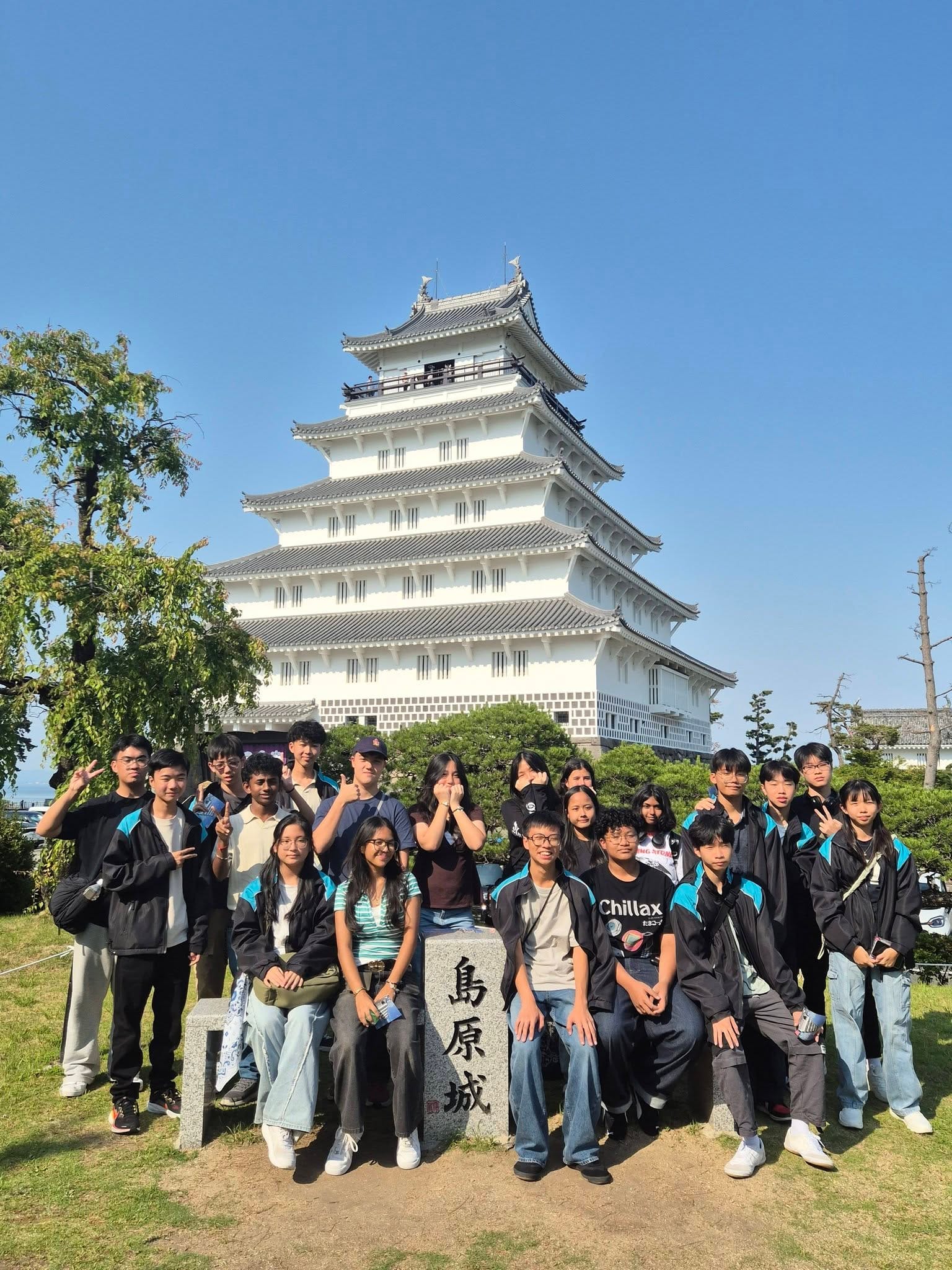 Students pose in front of Shimbara Castle