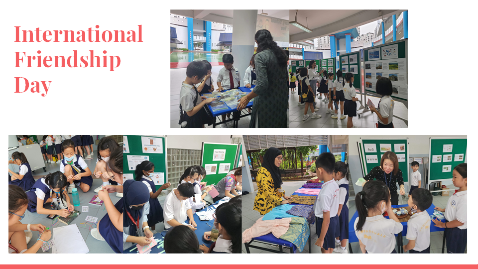 Students and teachers participate in International Friendship Day school activities with display boards and craft tables.
