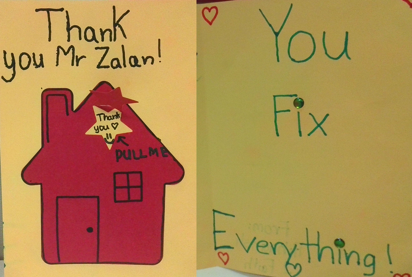 Two handmade yellow cards reading "Thank you Mr Zalan!" with a red house drawing, and "You Fix Everything!"