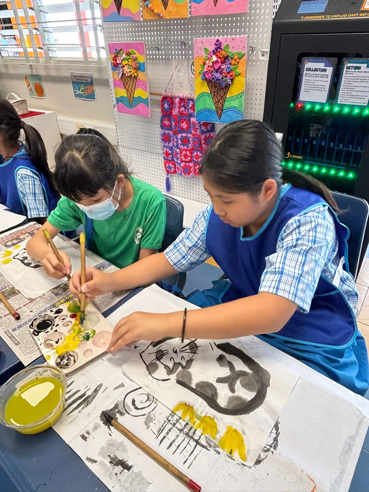Art Club students experiment with ink and colour painting.