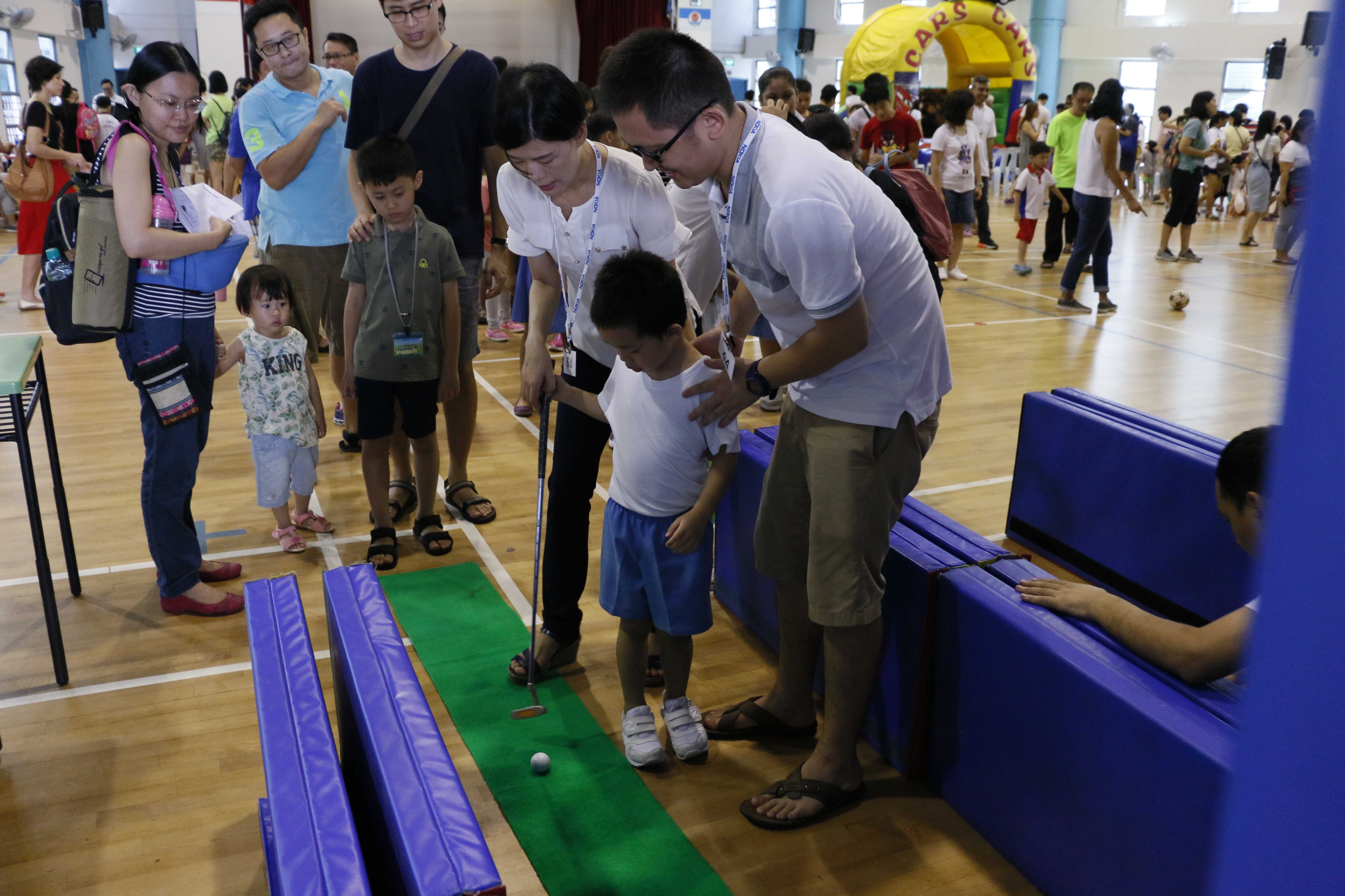 parent helping the child with the game