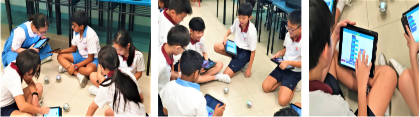 Three photos of young students in uniforms sitting on floors using tablets, with small robots visible nearby.