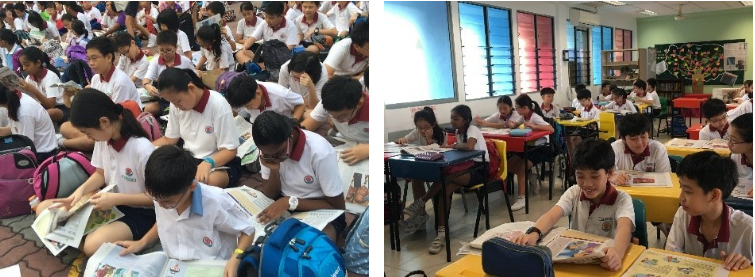 Students in white uniforms reading materials while seated on a floor and at desks in a colorful classroom.