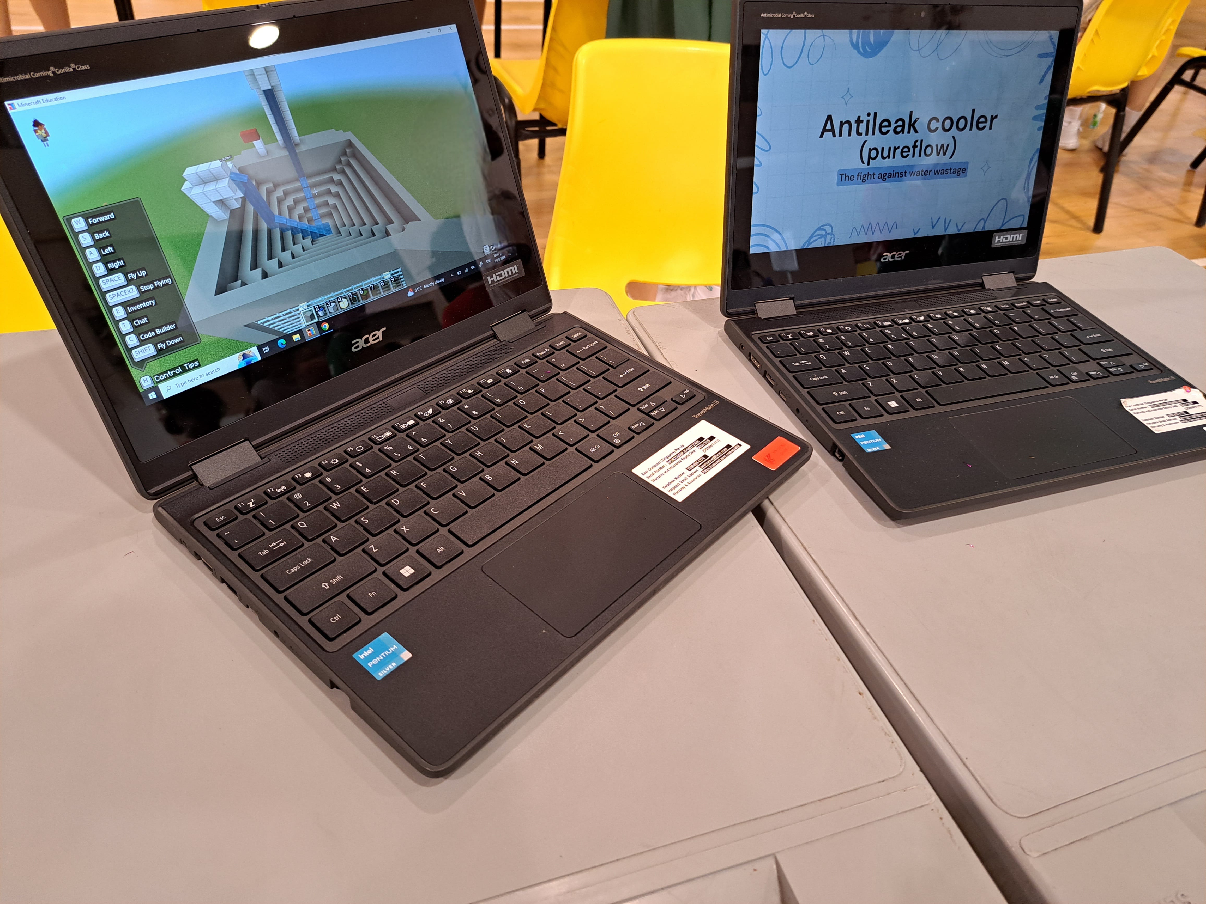 Two open laptops on tables; left shows a Minecraft build, right shows a slide titled Antileak cooler (pureflow).