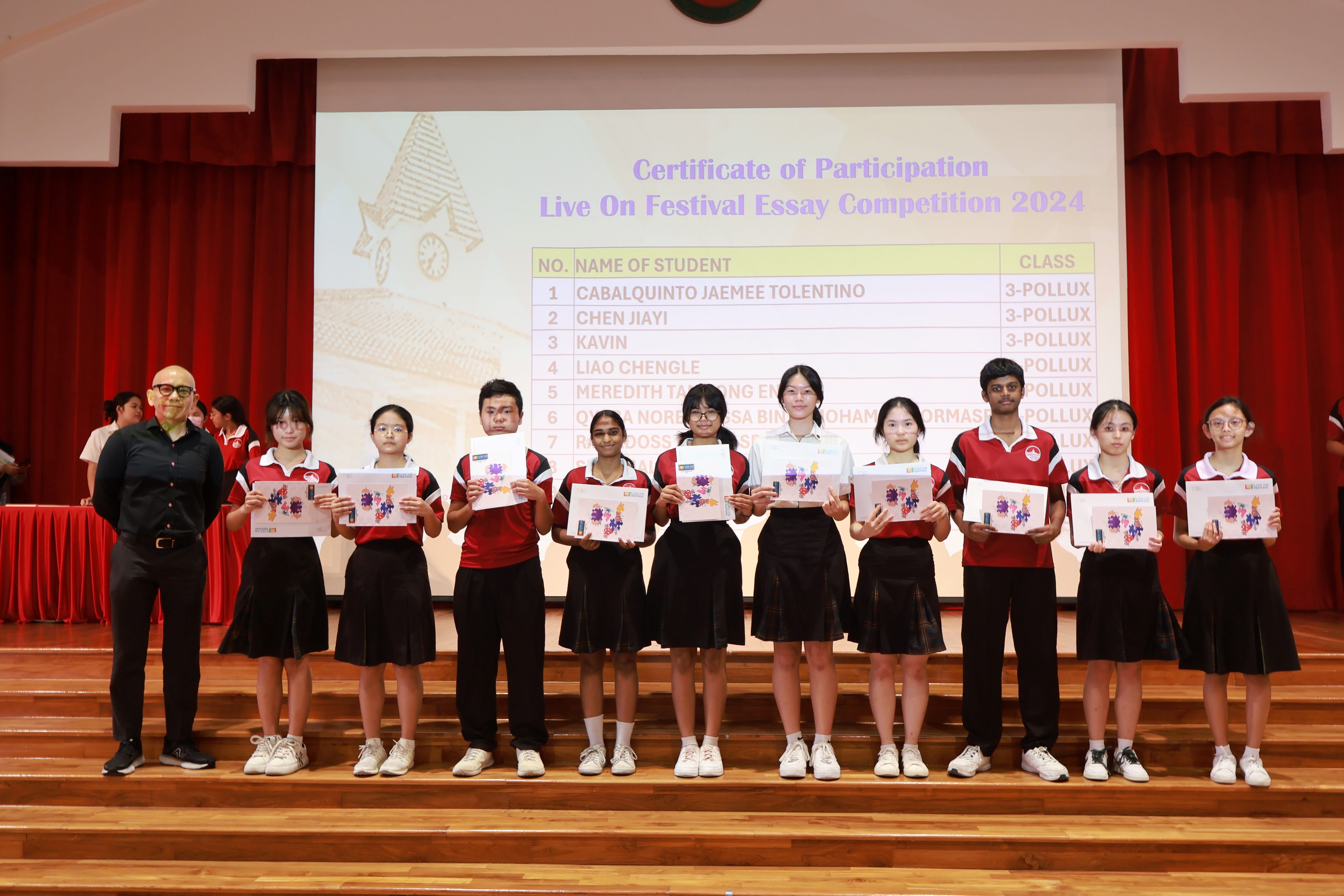 Northstars hold certificates on stage at the Live On Festival Essay Competition 2024 ceremony.