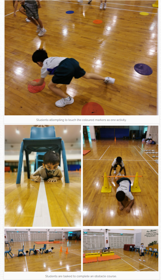 Children completing an obstacle course in a gym, crawling under chairs, under bars between cones, and touching colored markers.