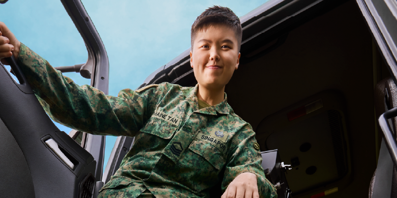 A female ADSS in uniform stepping out of a military vehicle.