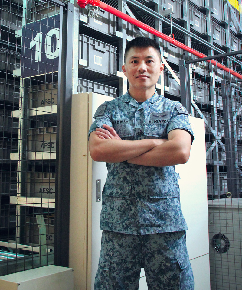 A cut-out image of ME4 Ang Chee standing infront of the storage system in his no.4 uniform.