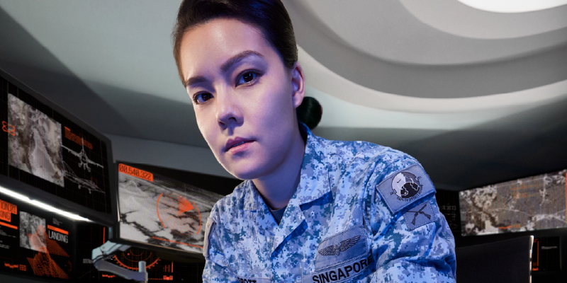 Air Warfare Officer seated in front of a high-tech workstation.