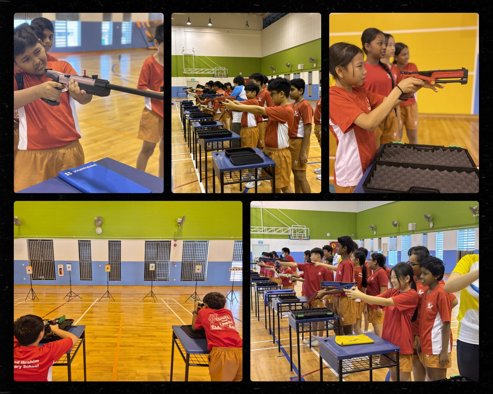 Students in red uniforms aim toy pistols at targets inside a school gymnasium during a shooting activity.