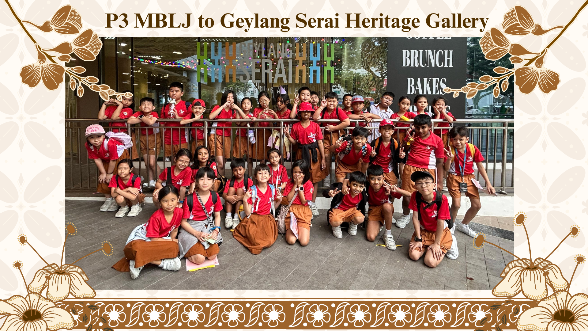 Group of young students in red uniforms posing outside Geylang Serai Heritage Gallery during a school trip.