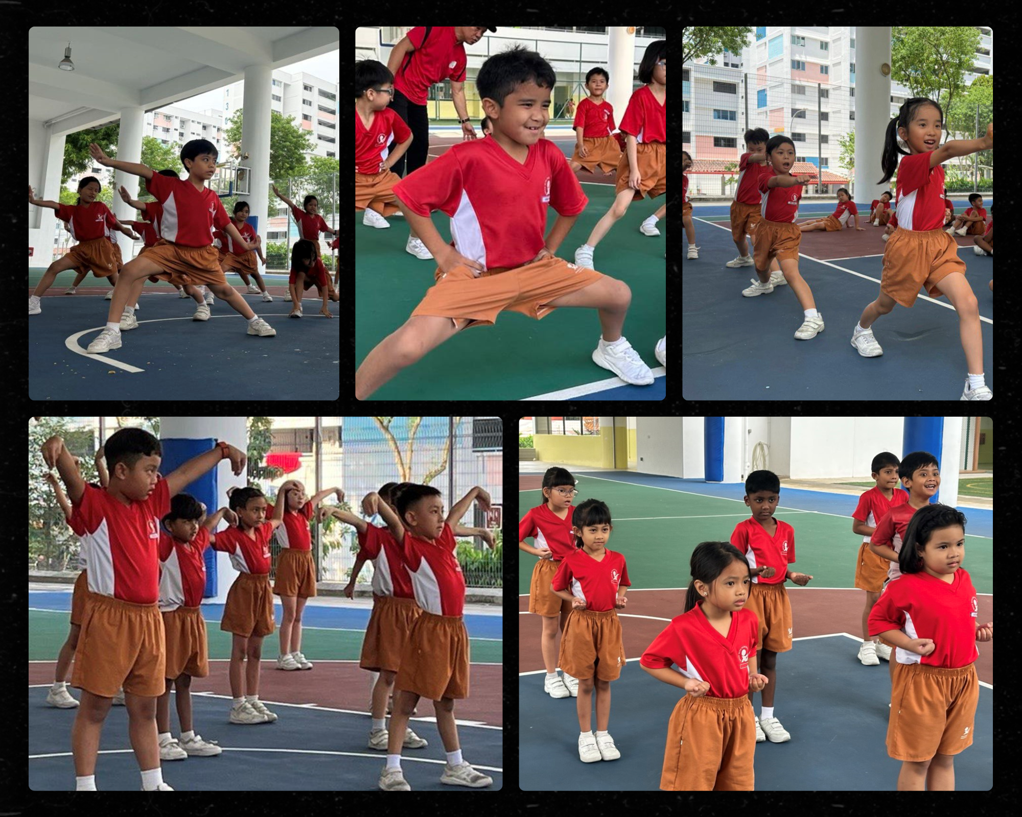Young children in red shirts and brown shorts practice martial arts poses on an outdoor school court.