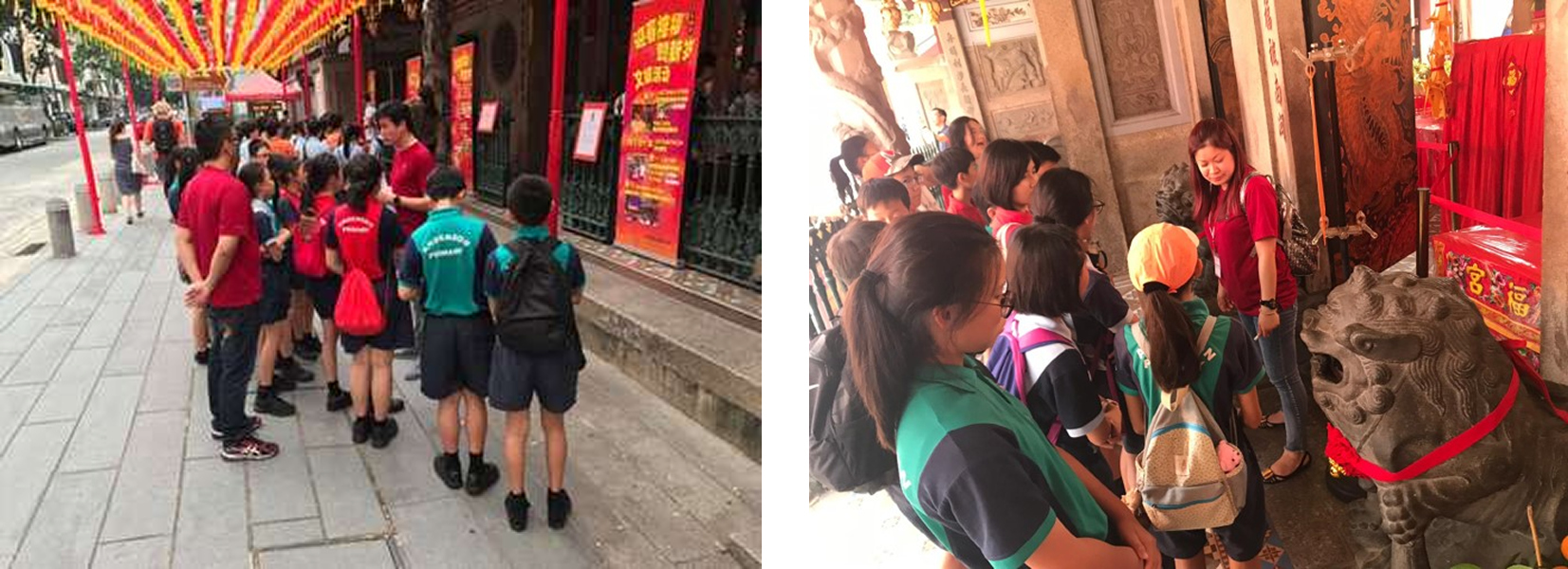 Schoolchildren line up outside a temple and gather inside near a stone lion statue and red decorations.