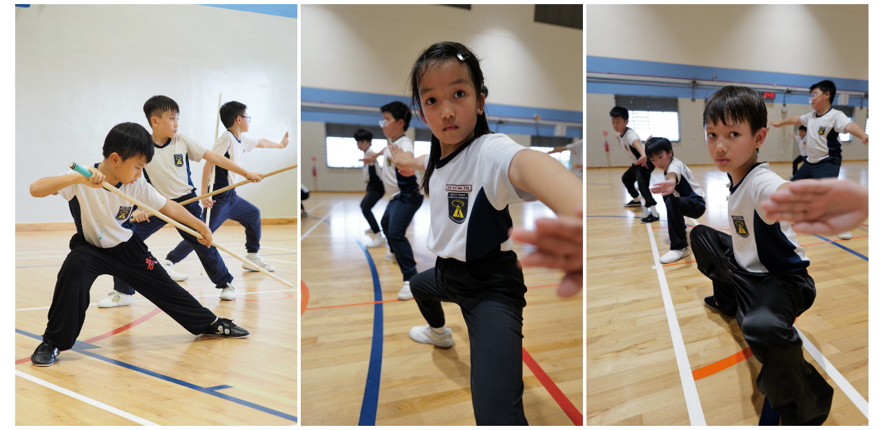 Students practise wushu forms, stances, and staff exercises during a training session in a school hall.