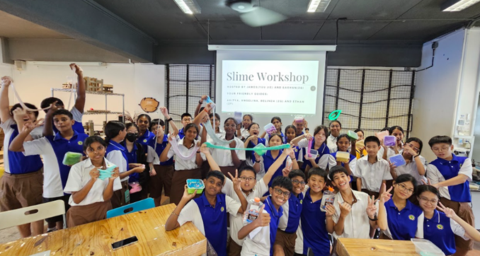 Students displaying their creations during a GEAR-UP Slime Workshop.