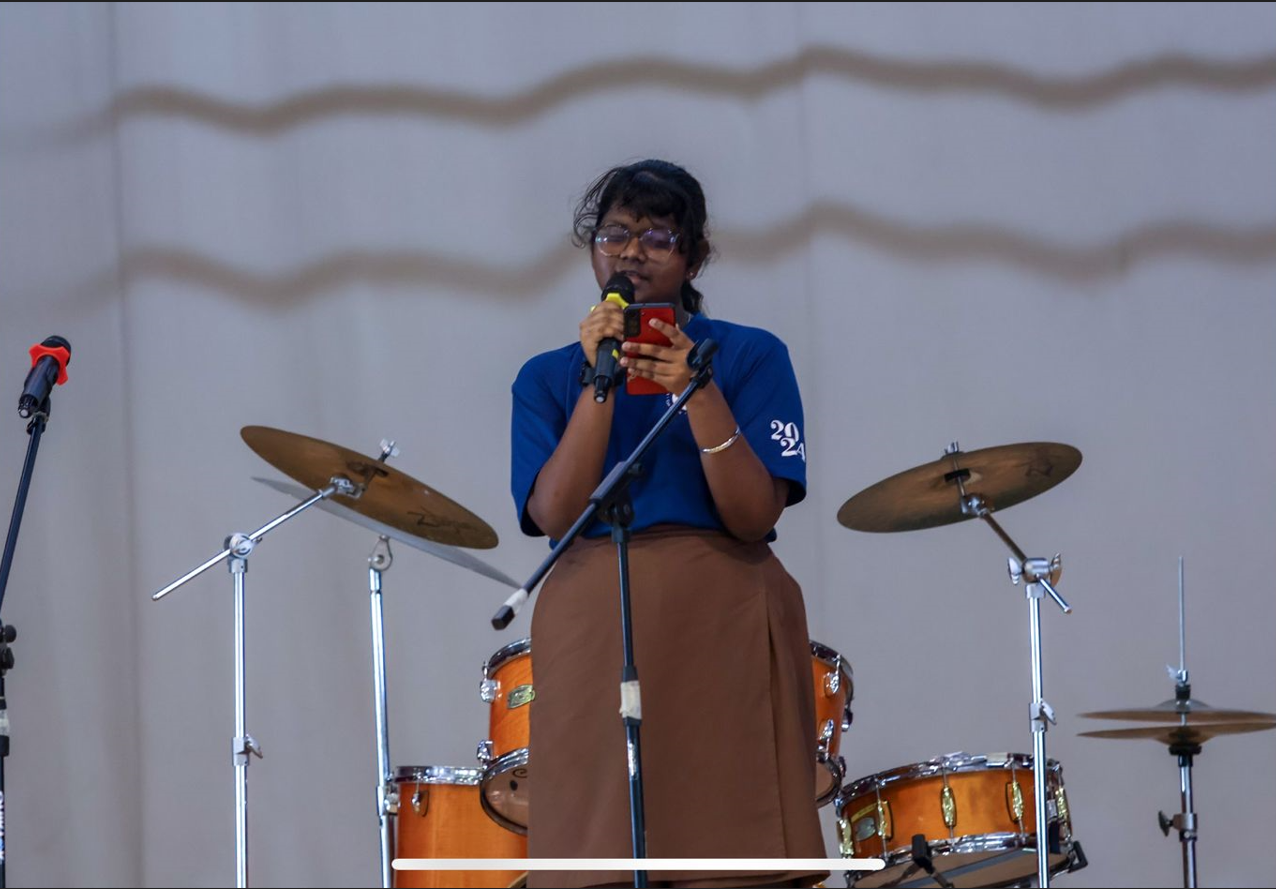 Student performing solo during a Youth Day celebration.