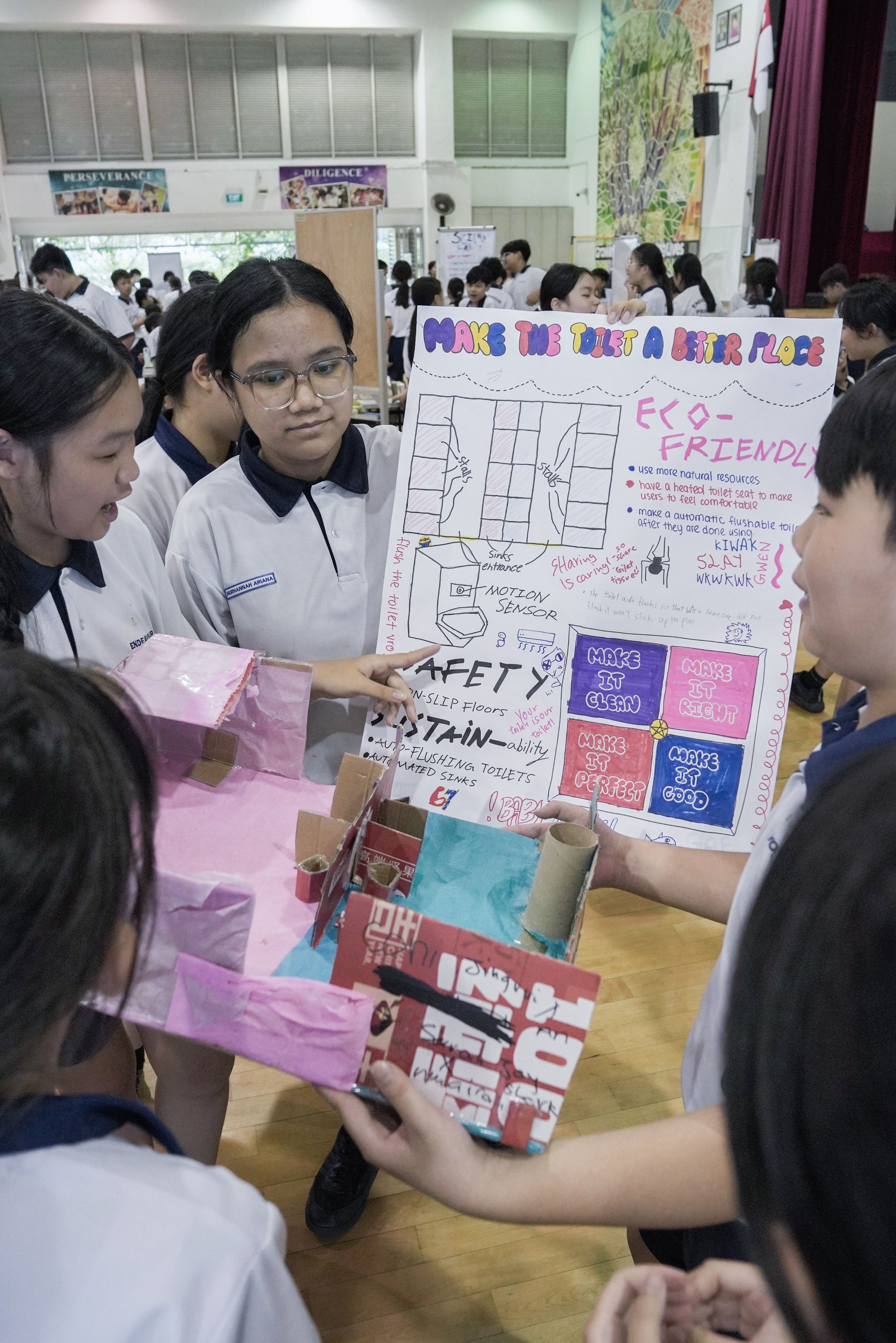 A group of students presenting their solution to a real-world problem