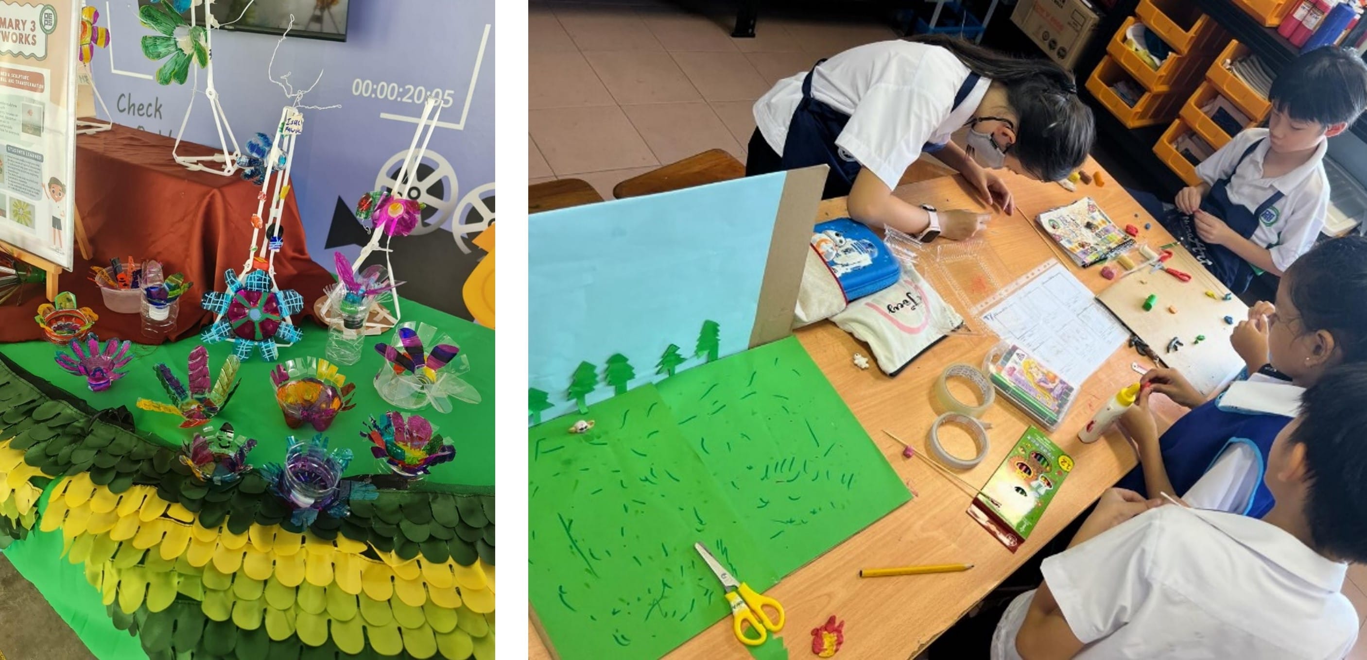 Students work on a colorful art project with green paper scenery beside a display of recycled plastic sculptures.