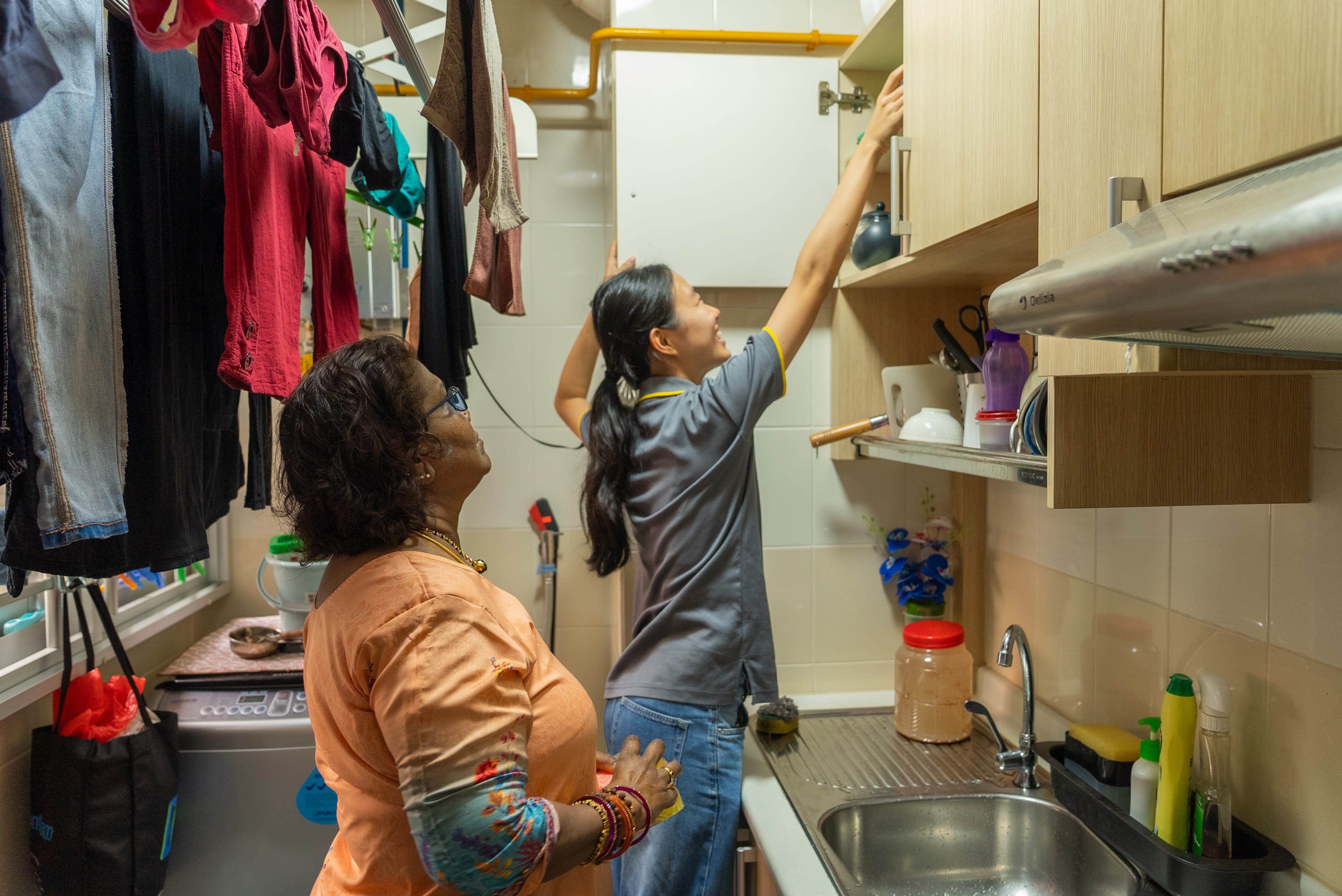 Megan assisting Mdm Kovila with the dishes